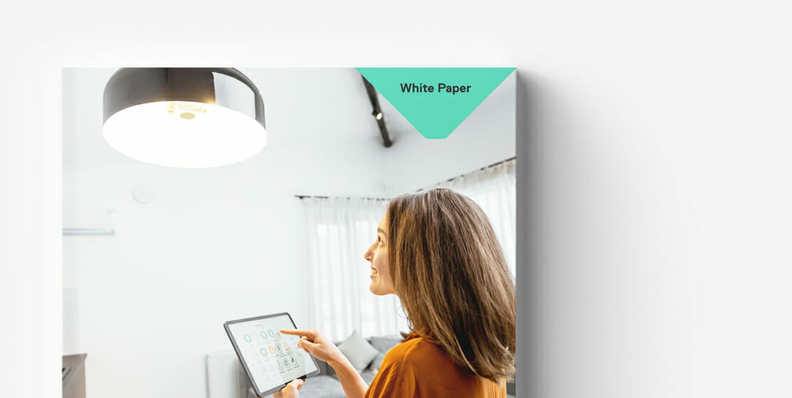 A woman in a brightly lit room uses a tablet. A small triangular banner in the upper corner reads "White Paper" on B2B Procurement.