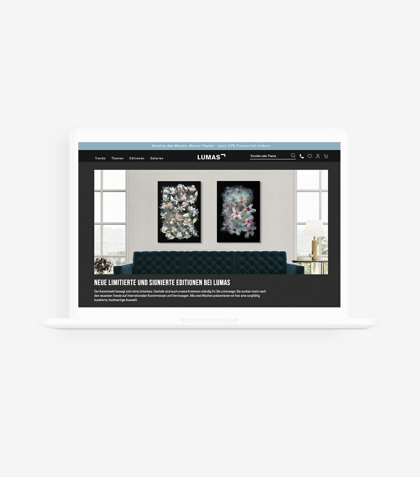 A laptop displays the LUMAS website featuring two framed floral artworks above a blue tufted sofa. The text below the images promotes new limited and signed editions, making it perfect for art buyers and first-time art buyers alike.