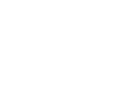 A black cat is sitting on a windowsill next to a houseplant, looking out the window as sunlight filters through, casting shadows on the wall. It's as peaceful as browsing a D2C commerce demo by Spryker.