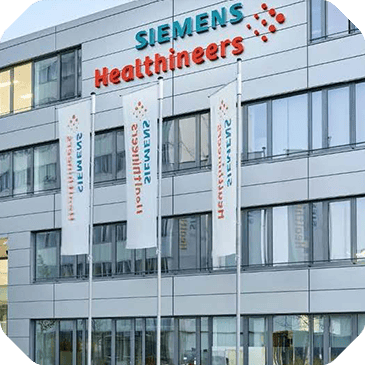 A modern building with Siemens Healthineers signage and three banners bearing the same name adorns the front facade, providing clear indicators of where customer insights can be gathered.