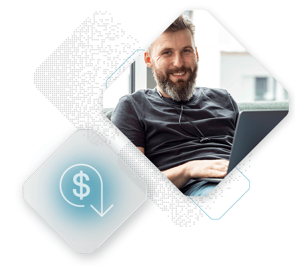 Man with a beard smiling while using a laptop, alongside a graphic of a dollar symbol with a downward arrow, exploring opportunities on Spryker Marketplace.