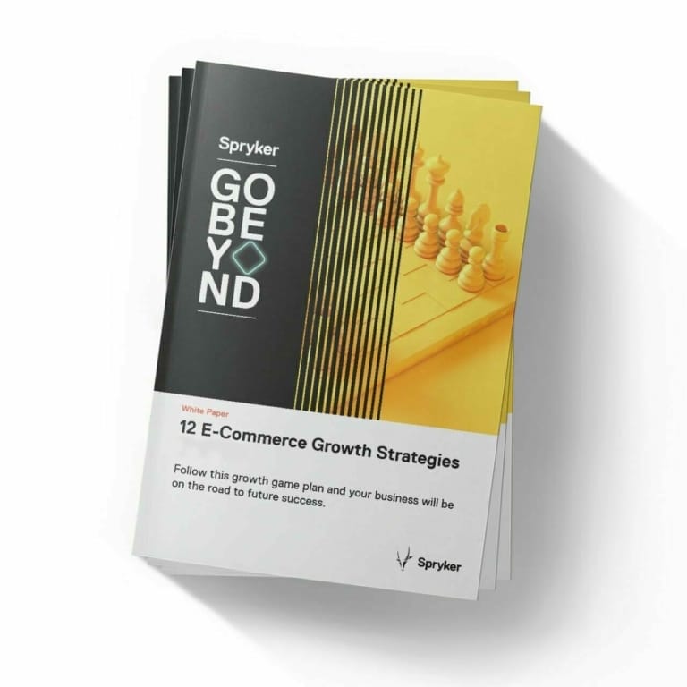 A stack of booklets titled "12 E-Commerce Growth Strategies" with a chess theme on the cover, published by Spryker Digital Commerce, featuring the tagline "Go Beyond.