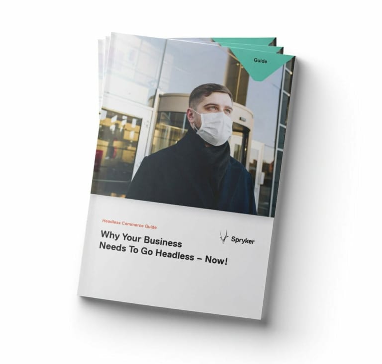 A person wearing a mask stands in front of a building on the cover of a magazine titled "Why Your Business Needs to Go Headless – Now!" by Spryker, featuring an essential headless commerce guide.